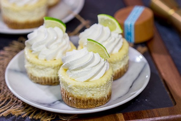 Lookin' for a fun dessert for warm evenings on the back porch? These Mini Margarita Cheesecakes are delicious! Cheers!