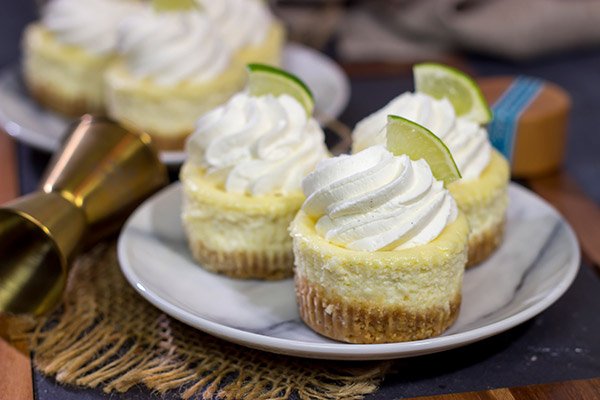 Lookin' for a fun dessert for warm evenings on the back porch? These Mini Margarita Cheesecakes are delicious! Cheers!