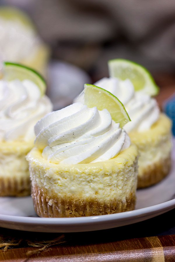 Lookin' for a fun dessert for warm evenings on the back porch? These Mini Margarita Cheesecakes are delicious! Cheers!