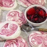 These Blackberry Meringues with Mixed Berry Compote are a light, airy dessert that's perfect for summer picnics!