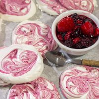 These Blackberry Meringues with Mixed Berry Compote are a light, airy dessert that's perfect for summer picnics!