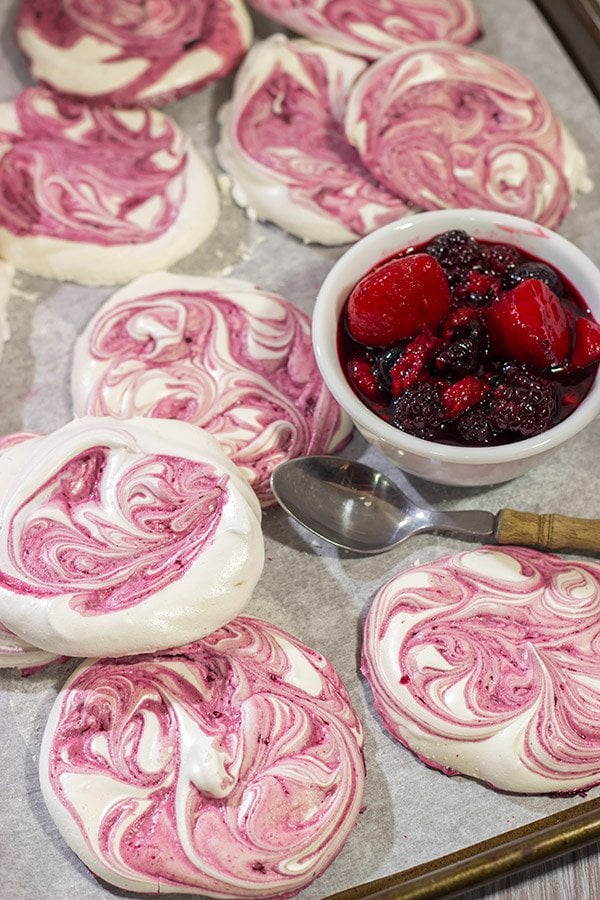 These Blackberry Meringues with Mixed Berry Compote are a light, airy dessert that's perfect for summer picnics!