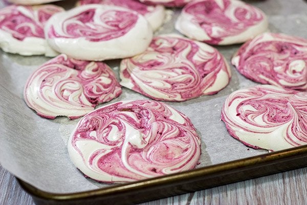 These Blackberry Meringues with Mixed Berry Compote are a light, airy dessert that's perfect for summer picnics!