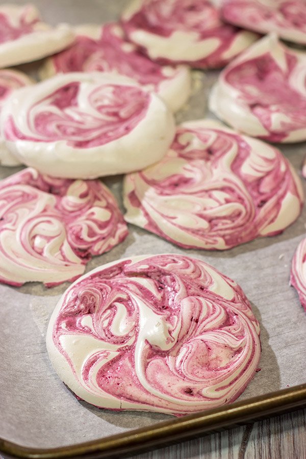 These Blackberry Meringues with Mixed Berry Compote are a light, airy dessert that's perfect for summer picnics!