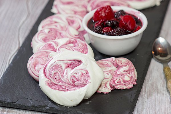 These Blackberry Meringues with Mixed Berry Compote are a light, airy dessert that's perfect for summer picnics!
