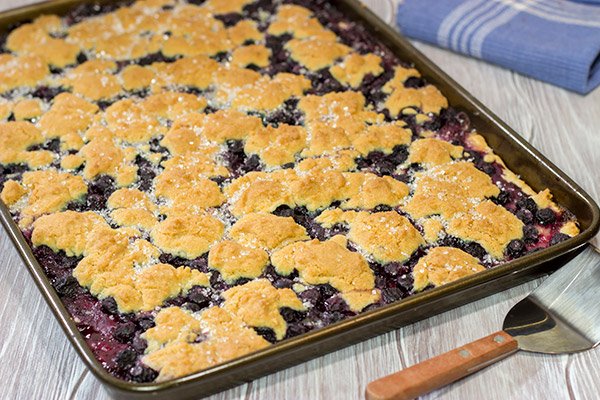 Looking to feed a crowd for a summer picnic? This Blueberry Slab Pie with Sugar Cookie Crust is a tasty answer!