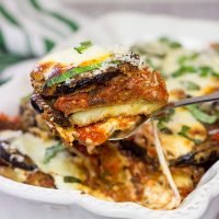 Featuring layers upon layers of flavorful eggplant, fresh mozzarella cheese and tomato sauce, this Eggplant Parmesan is a classic (and delicious) recipe!