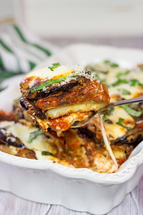 Featuring layers upon layers of flavorful eggplant, fresh mozzarella cheese and tomato sauce, this Eggplant Parmesan is a classic (and delicious) recipe!