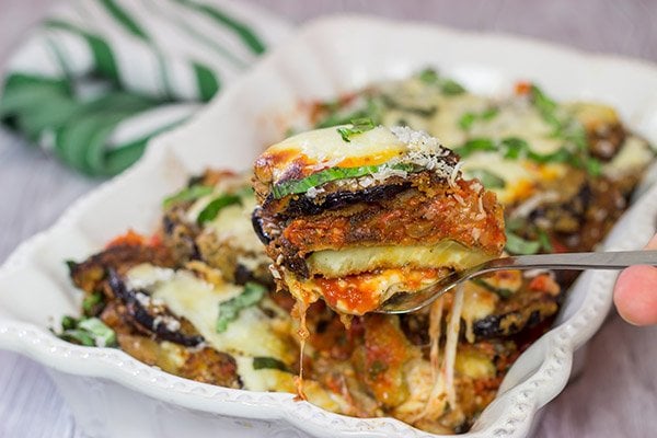 Featuring layers upon layers of flavorful eggplant, fresh mozzarella cheese and tomato sauce, this Eggplant Parmesan is a classic (and delicious) recipe!