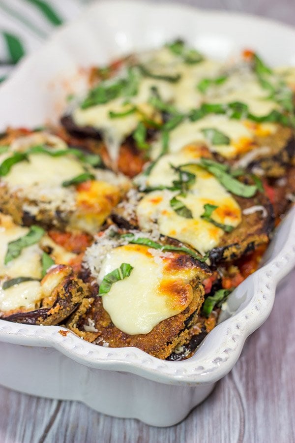 Featuring layers upon layers of flavorful eggplant, fresh mozzarella cheese and tomato sauce, this Eggplant Parmesan is a classic (and delicious) recipe!