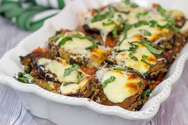 Featuring layers upon layers of flavorful eggplant, fresh mozzarella cheese and tomato sauce, this Eggplant Parmesan is a classic (and delicious) recipe!