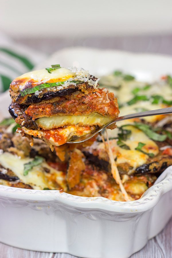 Featuring layers upon layers of flavorful eggplant, fresh mozzarella cheese and tomato sauce, this Eggplant Parmesan is a classic (and delicious) recipe!