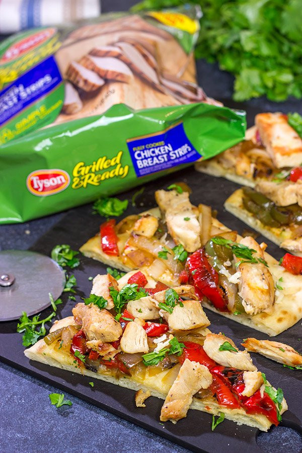 Looking for an easy and delicious dinner for game night? These Chicken Fajita Flatbreads are sure to be a family favorite!