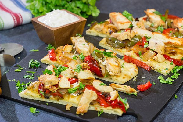 Looking for an easy and delicious dinner for game night? These Chicken Fajita Flatbreads are sure to be a family favorite!