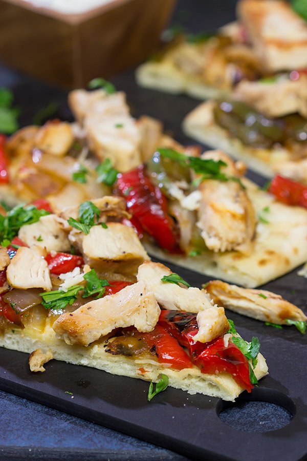 Looking for an easy and delicious dinner for game night? These Chicken Fajita Flatbreads are sure to be a family favorite!