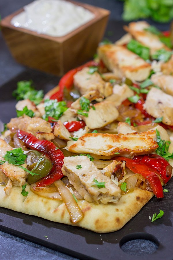 Looking for an easy and delicious dinner for game night? These Chicken Fajita Flatbreads are sure to be a family favorite!