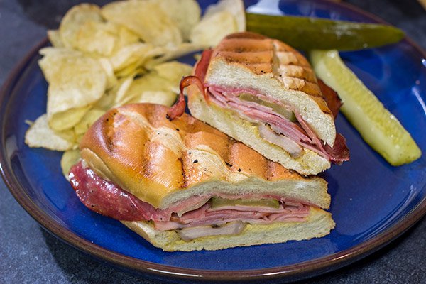 Packed with 3 types of meat, cheese and pickles, these Grilled Cuban Sandwiches are a delicious way to mix up dinner on the grill!