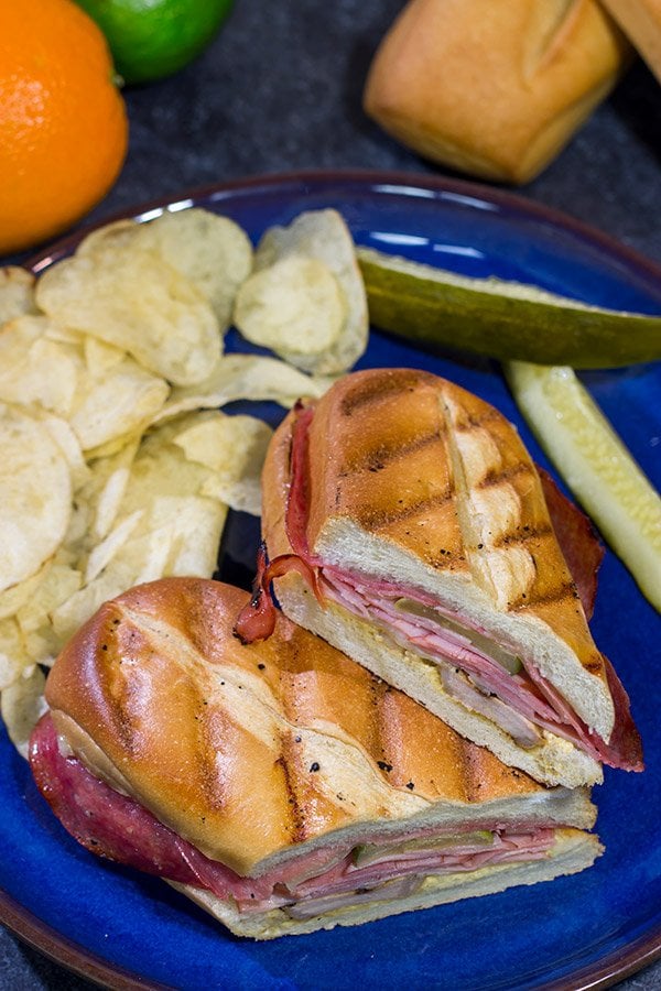 Packed with 3 types of meat, cheese and pickles, these Grilled Cuban Sandwiches are a delicious way to mix up dinner on the grill!
