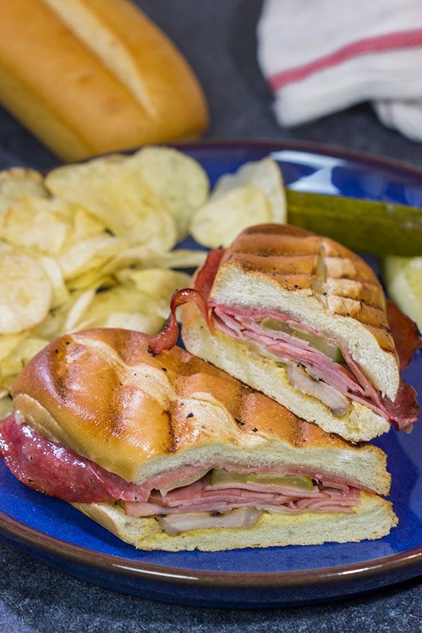 Packed with 3 types of meat, cheese and pickles, these Grilled Cuban Sandwiches are a delicious way to mix up dinner on the grill!