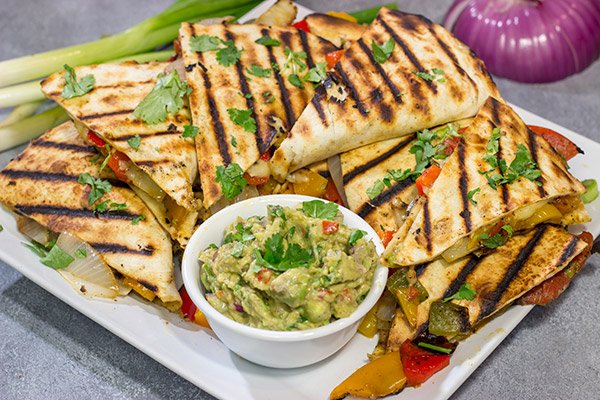 Packed with summer flavor, these Grilled Veggie Quesadillas are a tasty way to enjoy dinner on the grill!