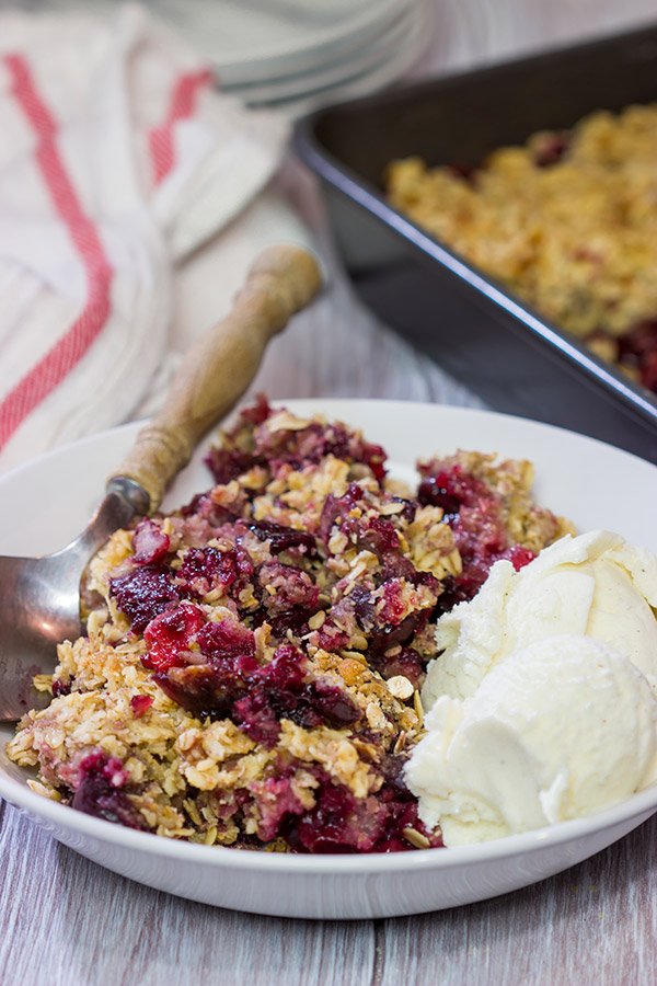 Topped with brown sugar and oats, this Sour Cherry Crumble is a tasty way to enjoy summer fruit! Just don't forget the ice cream!