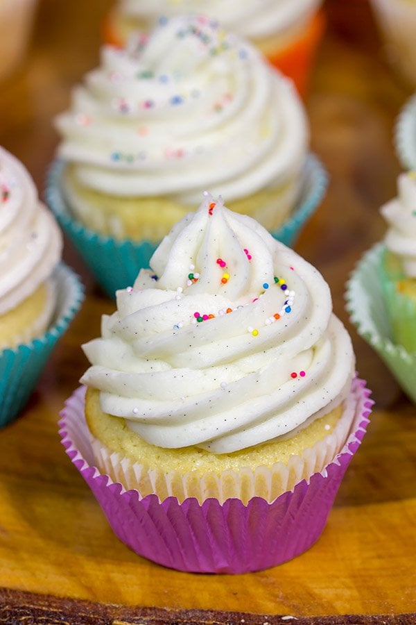 These Vanilla Cupcakes with Vanilla Bean Frosting are a classic!  The cupcakes are soft and fluffy, and the frosting is insanely delicious.  Bake up a batch today!