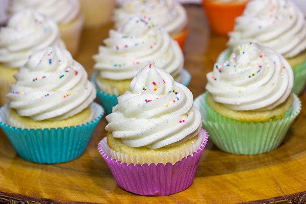 These Vanilla Cupcakes with Vanilla Bean Frosting are a classic!  The cupcakes are soft and fluffy, and the frosting is insanely delicious.  Bake up a batch today!