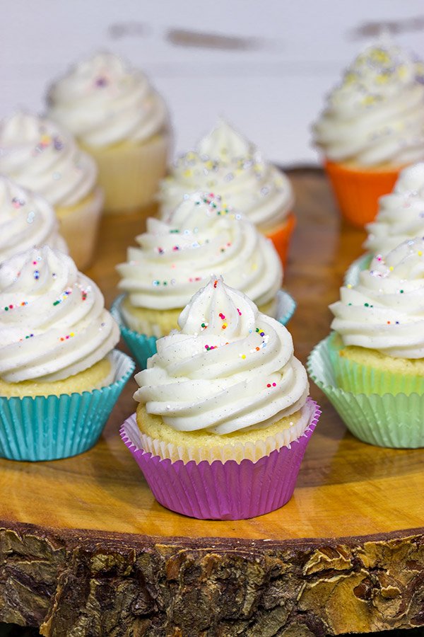 These Vanilla Cupcakes with Vanilla Bean Frosting are a classic!  The cupcakes are soft and fluffy, and the frosting is insanely delicious.  Bake up a batch today!