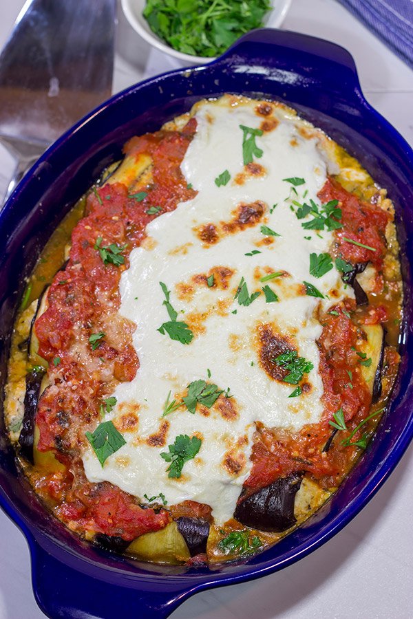 Eggplant Involtini is a classic Italian recipe.  This version features a lemon herb ricotta filling rolled up inside of slices of roasted eggplant.  It's delicious!