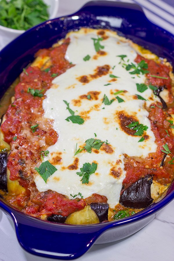 Eggplant Involtini is a classic Italian recipe.  This version features a lemon herb ricotta filling rolled up inside of slices of roasted eggplant.  It's delicious!