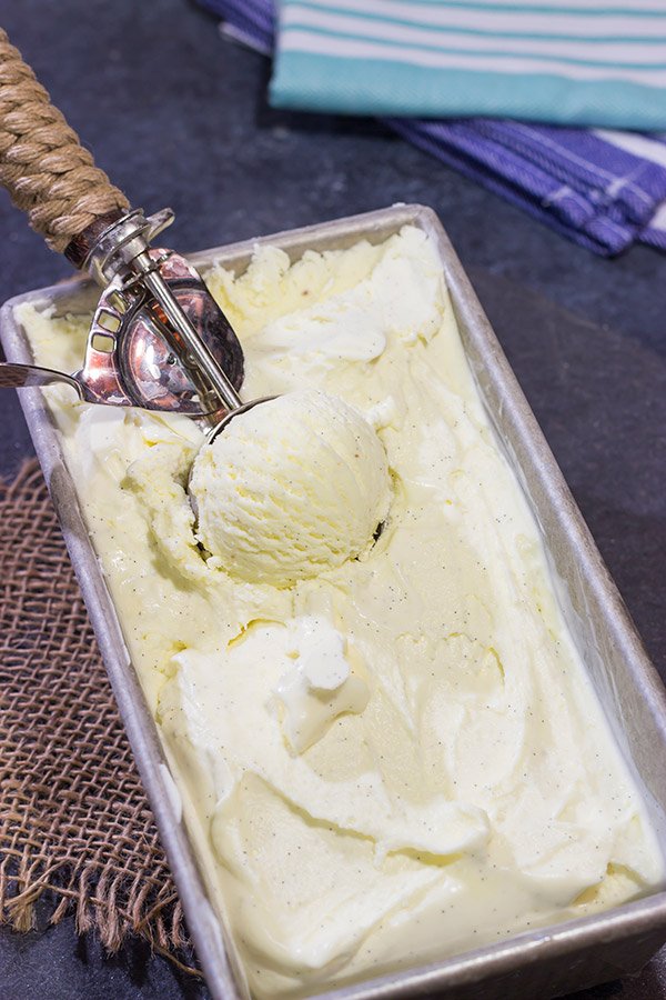 This homemade French Vanilla Ice Cream is packed with vanilla beans for a deep vanilla flavor.  Grab a scoop for dessert tonight!