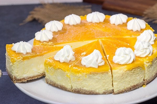 This Passion Fruit Cheesecake is packed with tropical flavors! It's the perfect dessert for a warm summer evening. Cheers!