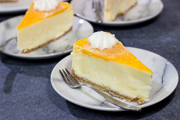 This Passion Fruit Cheesecake is packed with tropical flavors! It's the perfect dessert for a warm summer evening. Cheers!