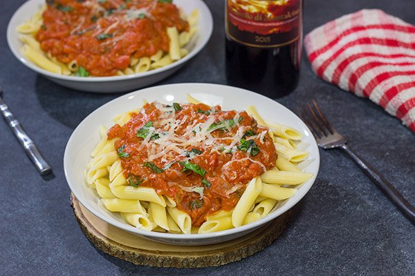 Penne alla Vodka features pasta with an easy, creamy pasta sauce (and, yes, the pasta sauce calls for a bit of vodka)!