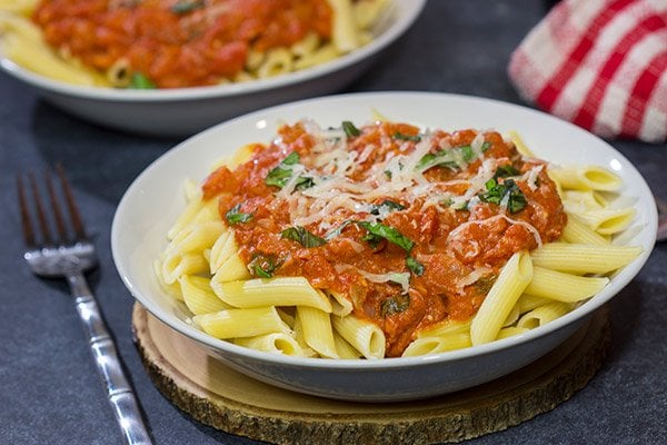 Penne alla Vodka features pasta with an easy, creamy pasta sauce (and, yes, the pasta sauce calls for a bit of vodka)!