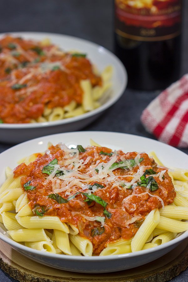 Penne alla Vodka features pasta with an easy, creamy pasta sauce (and, yes, the pasta sauce calls for a bit of vodka)!