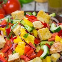 Packed with fresh veggies and perfectly toasted bread cubes, Panzanella is a classic side dish that's great for summer entertaining!