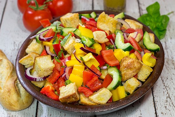 Packed with fresh veggies and perfectly toasted bread cubes, Panzanella is a classic side dish that's great for summer entertaining!
