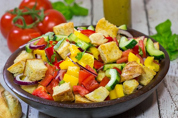 Packed with fresh veggies and perfectly toasted bread cubes, Panzanella is a classic side dish that's great for summer entertaining!