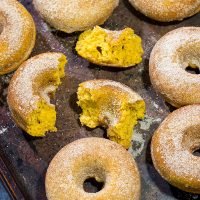 These Baked Pumpkin Spice Donuts are packed with cinnamon and pumpkin...and they're the perfect sweet treat for a chilly Autumn day!