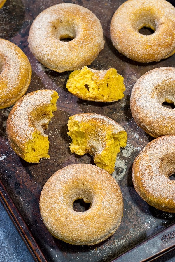 These Baked Pumpkin Spice Donuts are packed with cinnamon and pumpkin...and they're the perfect sweet treat for a chilly Autumn day!
