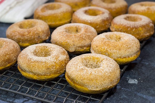 These Baked Pumpkin Spice Donuts are packed with cinnamon and pumpkin...and they're the perfect sweet treat for a chilly Autumn day!