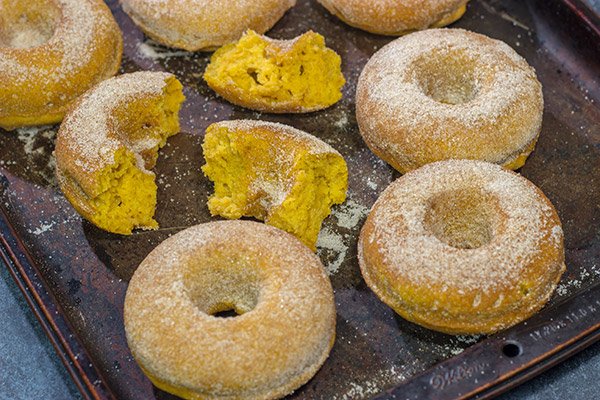 These Baked Pumpkin Spice Donuts are packed with cinnamon and pumpkin...and they're the perfect sweet treat for a chilly Autumn day!