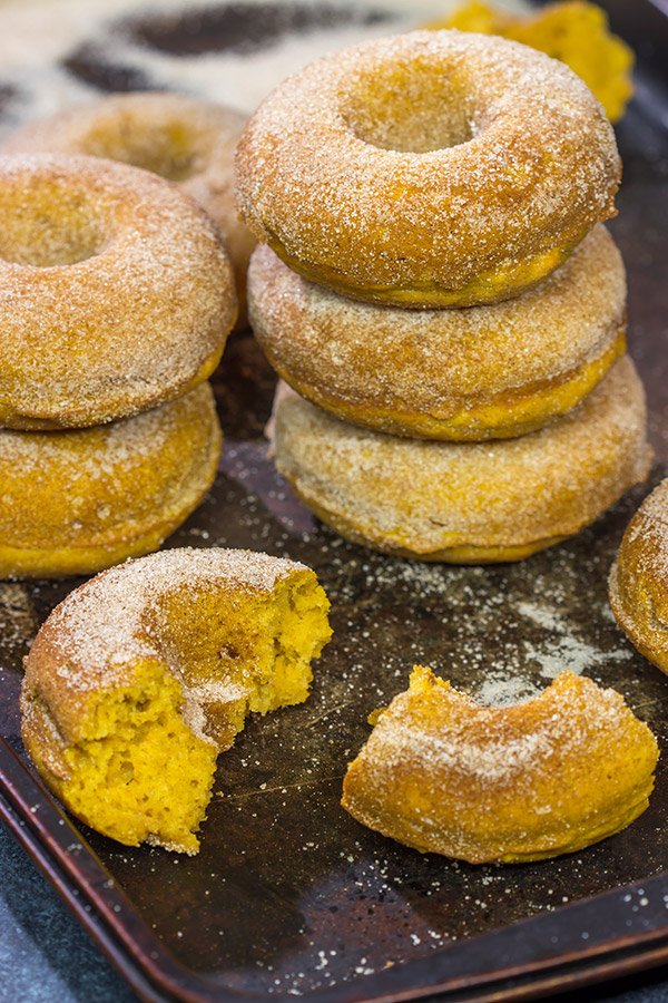 These Baked Pumpkin Spice Donuts are packed with cinnamon and pumpkin...and they're the perfect sweet treat for a chilly Autumn day!