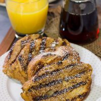 Fire up that grill and get your day off to a delicious start!  This Grilled French Toast is a fun (and tasty) way to enjoy breakfast on the grill.
