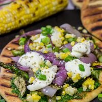 These Grilled Vegetable Flatbreads are a delicious (and easy) summer recipe. Feel free to use whatever veggies are in the garden or on sale!
