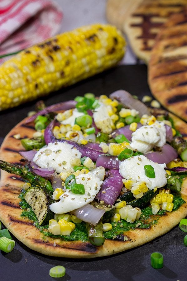 These Grilled Vegetable Flatbreads are a delicious (and easy) summer recipe. Feel free to use whatever veggies are in the garden or on sale!