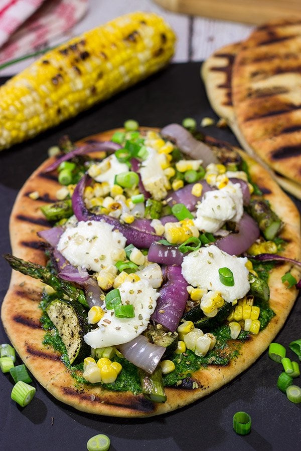 These Grilled Vegetable Flatbreads are a delicious (and easy) summer recipe.  Feel free to use whatever veggies are in the garden or on sale!