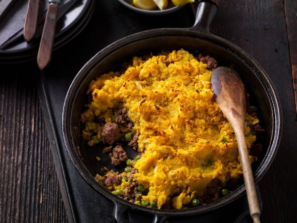 This classic Shepherd's Pie dish is reimagined with Ground Beef and warm, exotic spices such as garam masala, turmeric, and ginger, topped with mashed cauliflower.