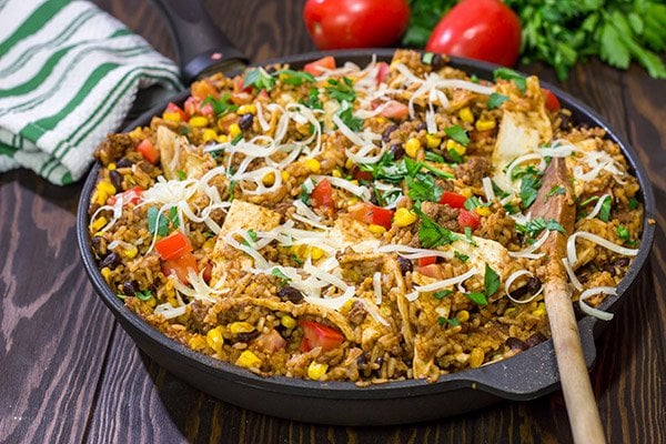Looking for a fun way to mix up week night dinners?  Mix the burritos right into the filling with these tasty Skillet Beef Burritos!